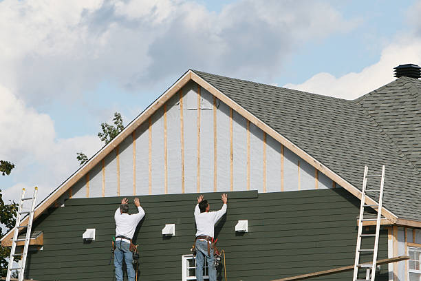 Professional Siding technician working in Delta, OH